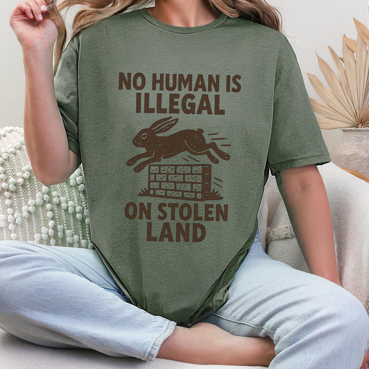 No Human Is Illegal T‑ graphic shirt featuring Social Justice Immigration Message