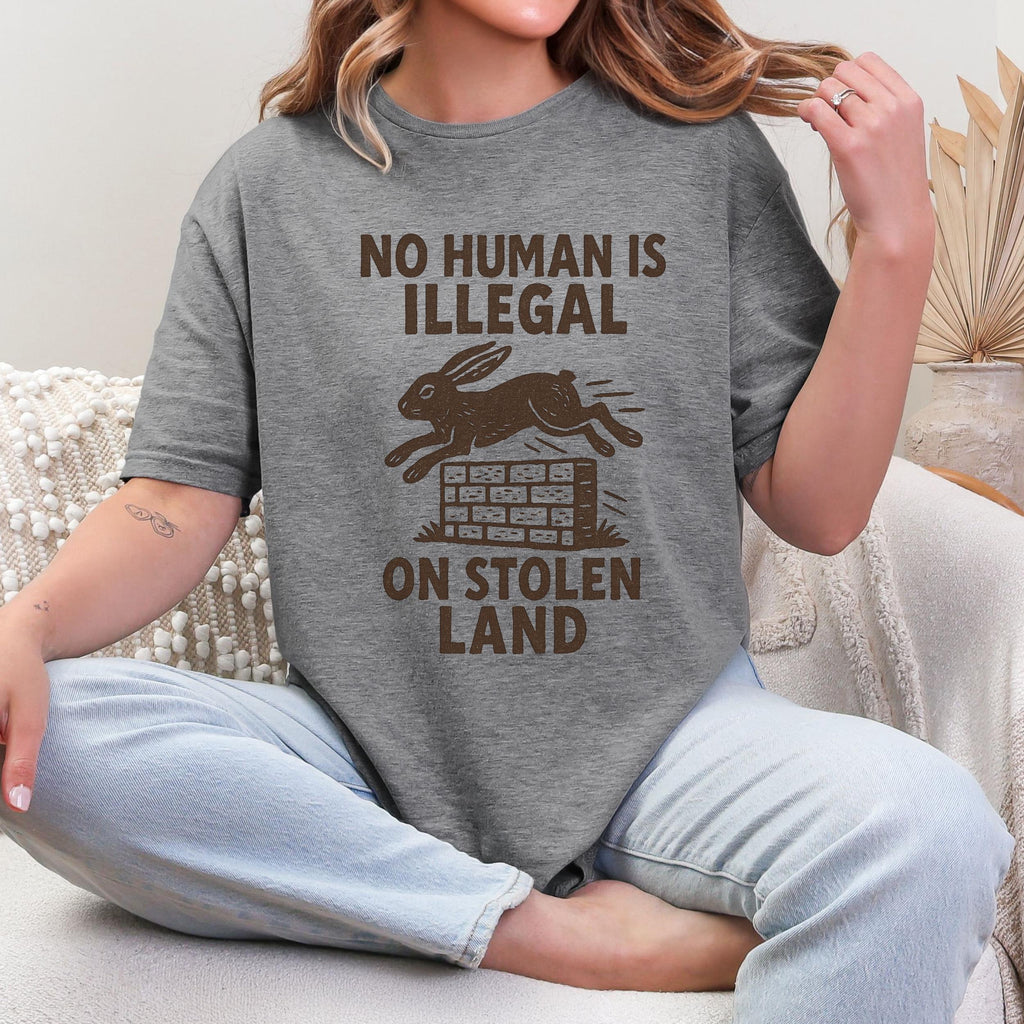 No Human Is Illegal T‑ graphic shirt featuring Social Justice Immigration Message