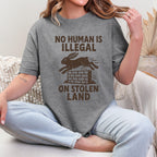 No Human Is Illegal T‑ graphic shirt featuring Social Justice Immigration Message