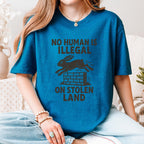 No Human Is Illegal T‑ graphic shirt featuring Social Justice Immigration Message