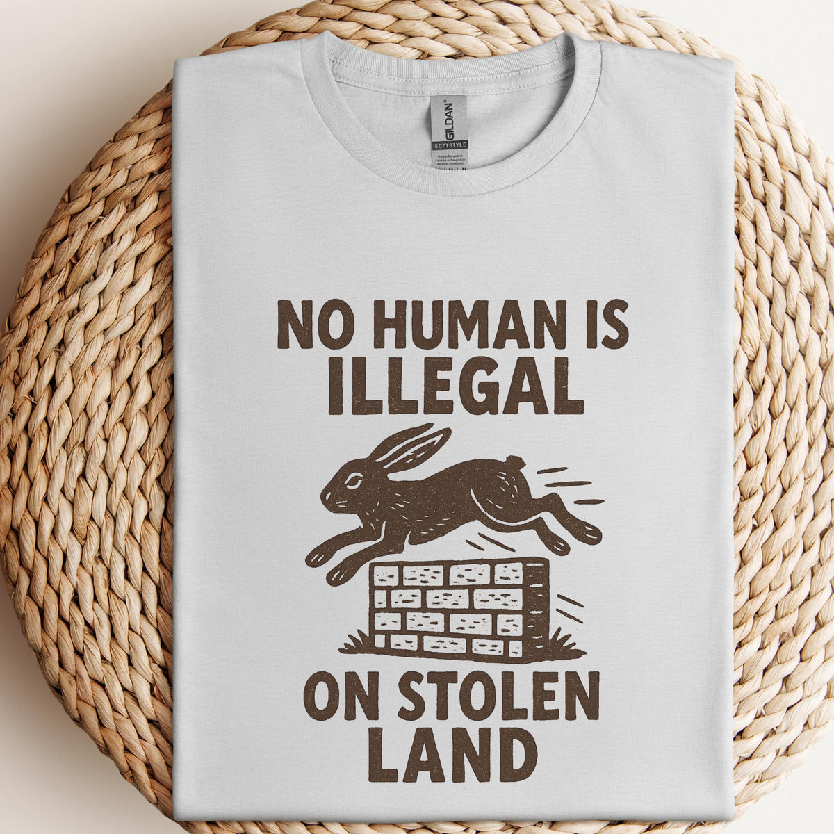 No Human Is Illegal T‑ graphic shirt featuring Social Justice Immigration Message