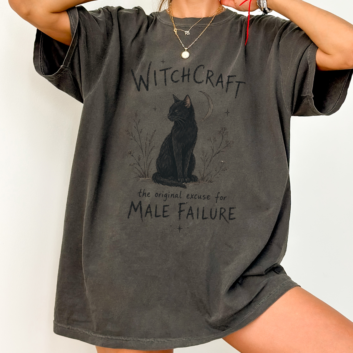 Witchcraft Cat graphic shirt featuring 'The Original Excuse for Male Failure'