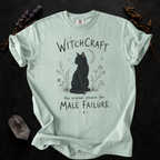 Witchcraft Cat graphic shirt featuring 'The Original Excuse for Male Failure'