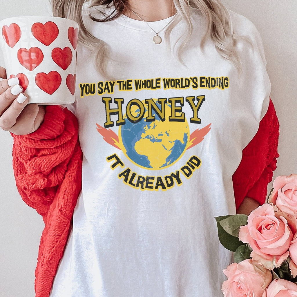 Graphic graphic shirt featuring "You Say the Whole World’s Ending Honey It in Black