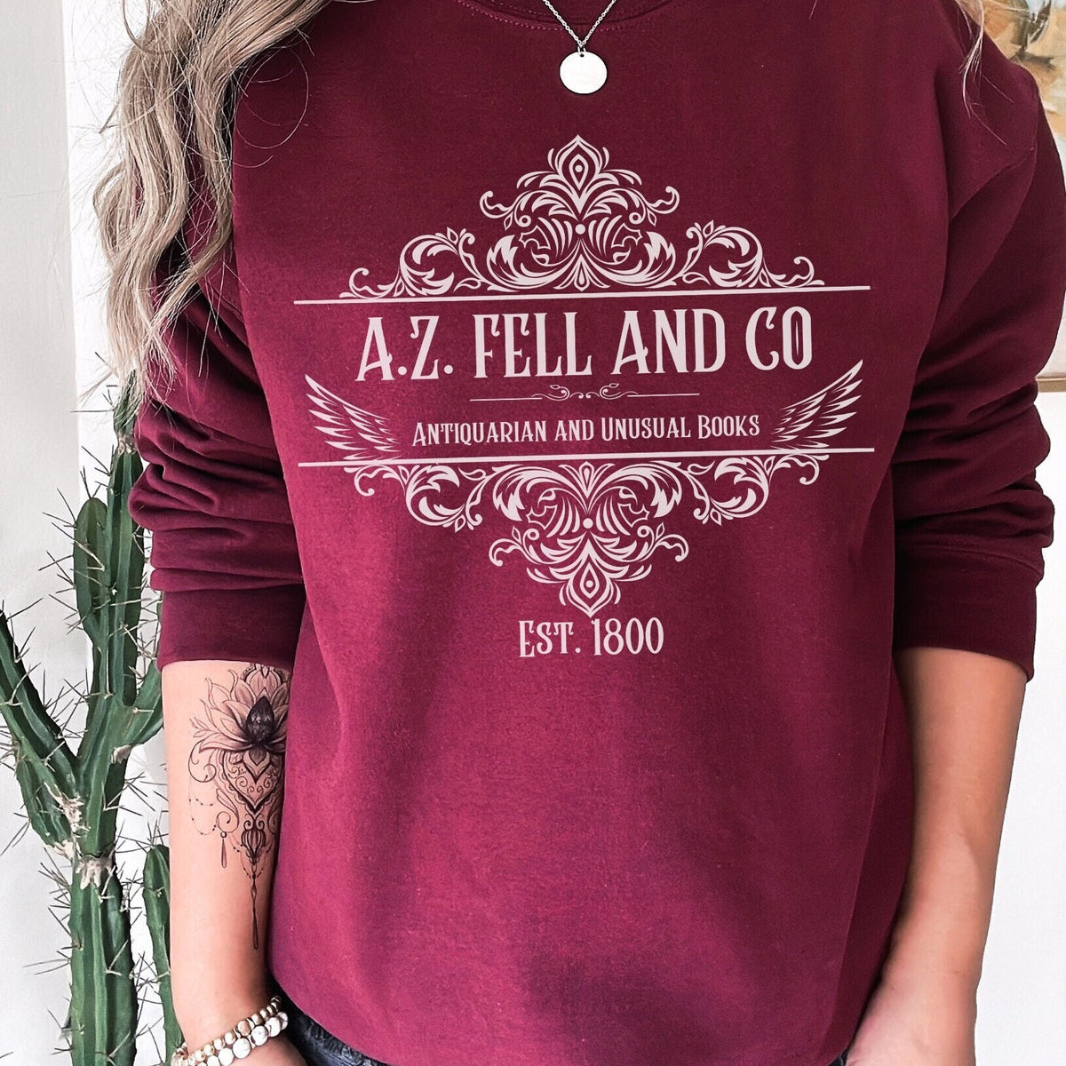 A.Z. Fell and Co graphic sweatshirt featuring Good Omens Aziraphale Bookshop Crewneck