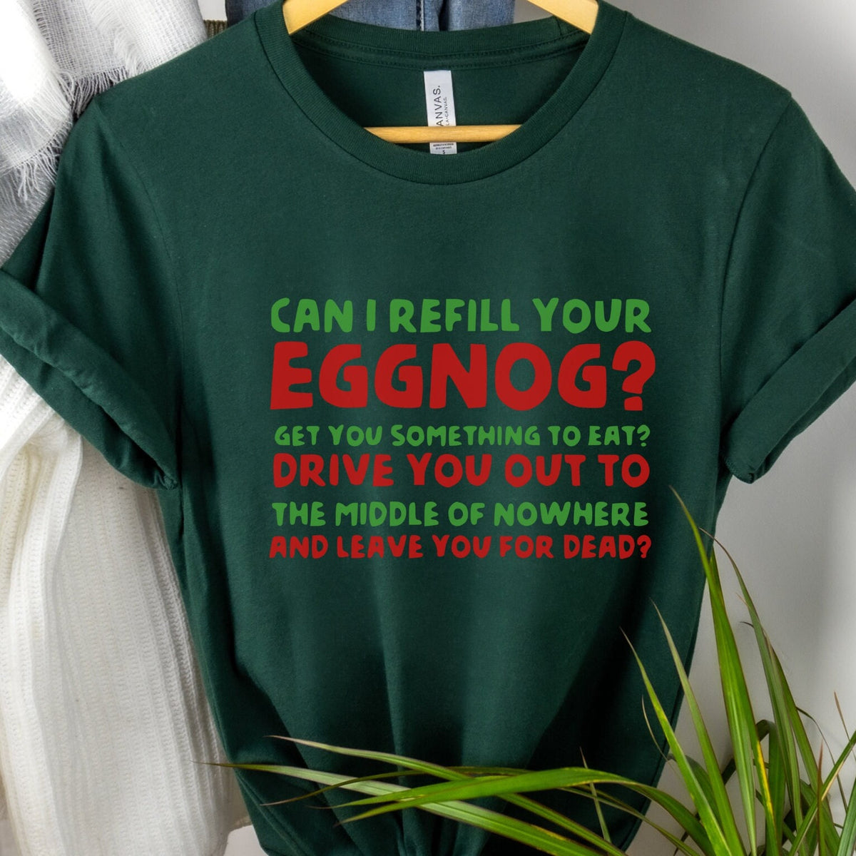 T‑ graphic shirt featuring "Can I Refill Your Eggnog?" Funny Holiday