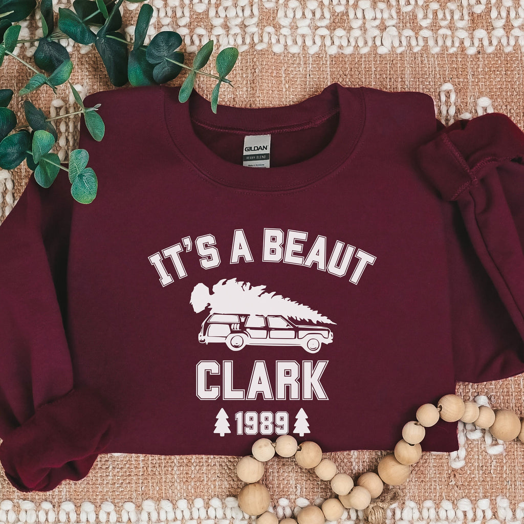 Crewneck Sweatshirt graphic sweatshirt featuring "It's a Beaut Clark 1989" Vintage Tree-Laden in Ash