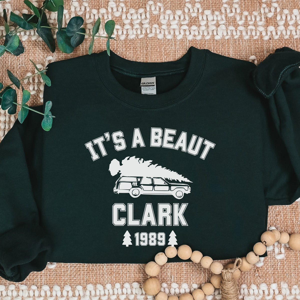 Crewneck Sweatshirt graphic sweatshirt featuring "It's a Beaut Clark 1989" Vintage Tree-Laden