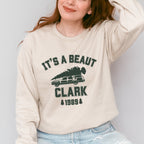 Crewneck Sweatshirt graphic sweatshirt featuring "It's a Beaut Clark 1989" Vintage Tree-Laden
