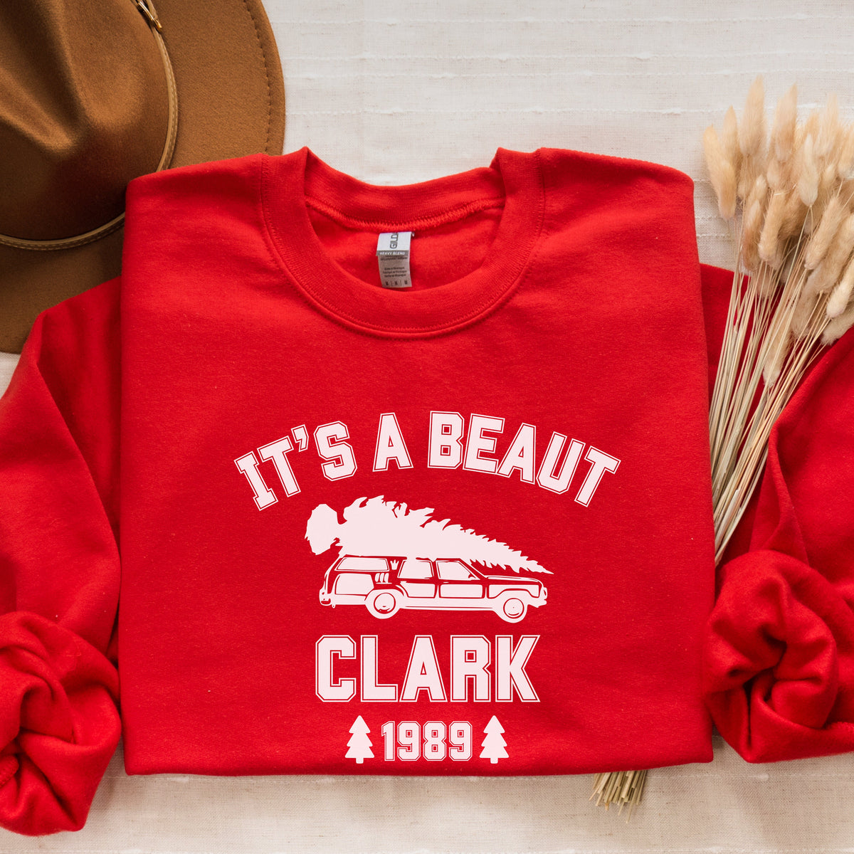 Crewneck Sweatshirt graphic sweatshirt featuring "It's a Beaut Clark 1989" Vintage Tree-Laden