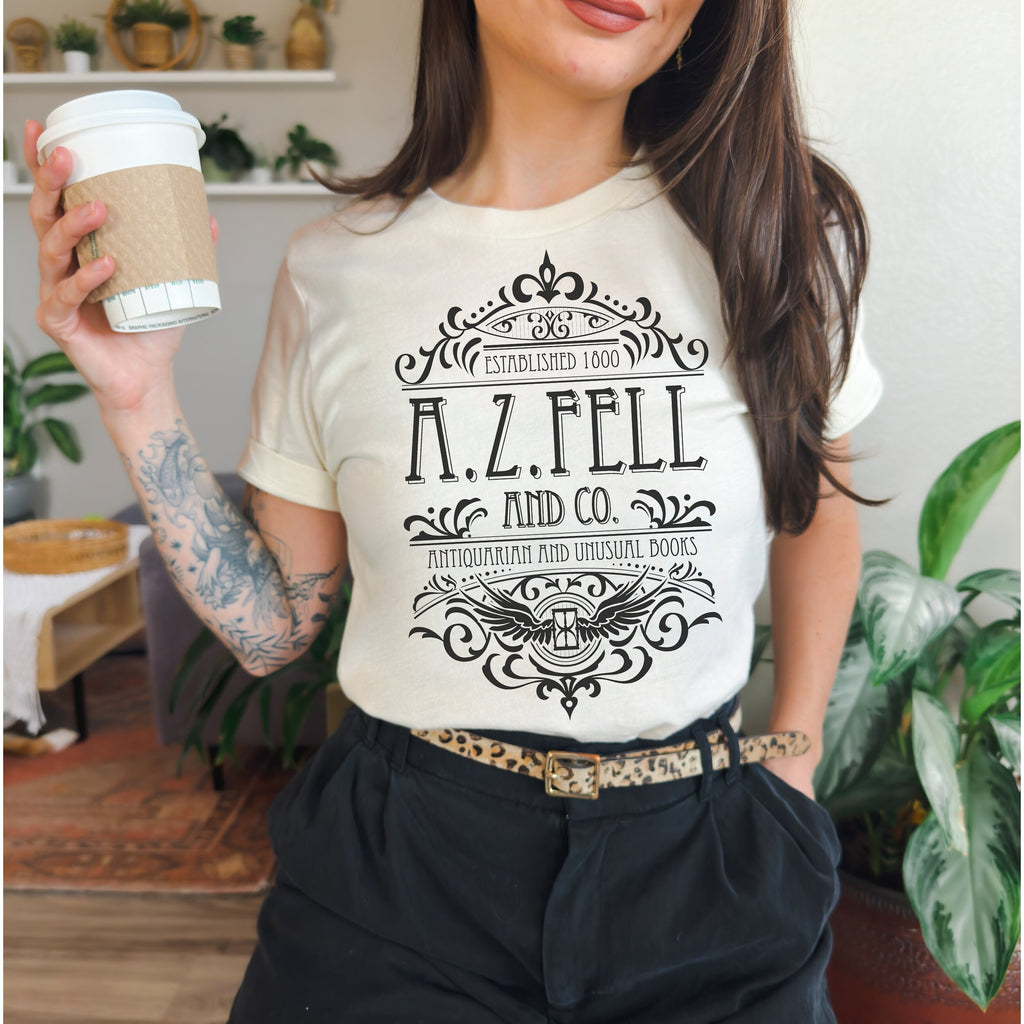 Good Omens A.Z. Fell and Co Antiquarian and Unusual graphic shirt featuring Aziraphale & Crowley Bookish Tee