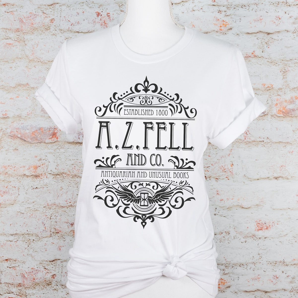Good Omens A.Z. Fell and Co Antiquarian and Unusual graphic shirt featuring Aziraphale & Crowley Bookish Tee