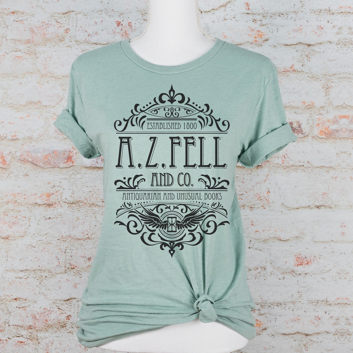 Good Omens A.Z. Fell and Co Antiquarian and Unusual graphic shirt featuring Aziraphale & Crowley Bookish Tee