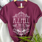 Good Omens A.Z. Fell and Co Antiquarian and Unusual graphic shirt featuring Aziraphale & Crowley Bookish Tee