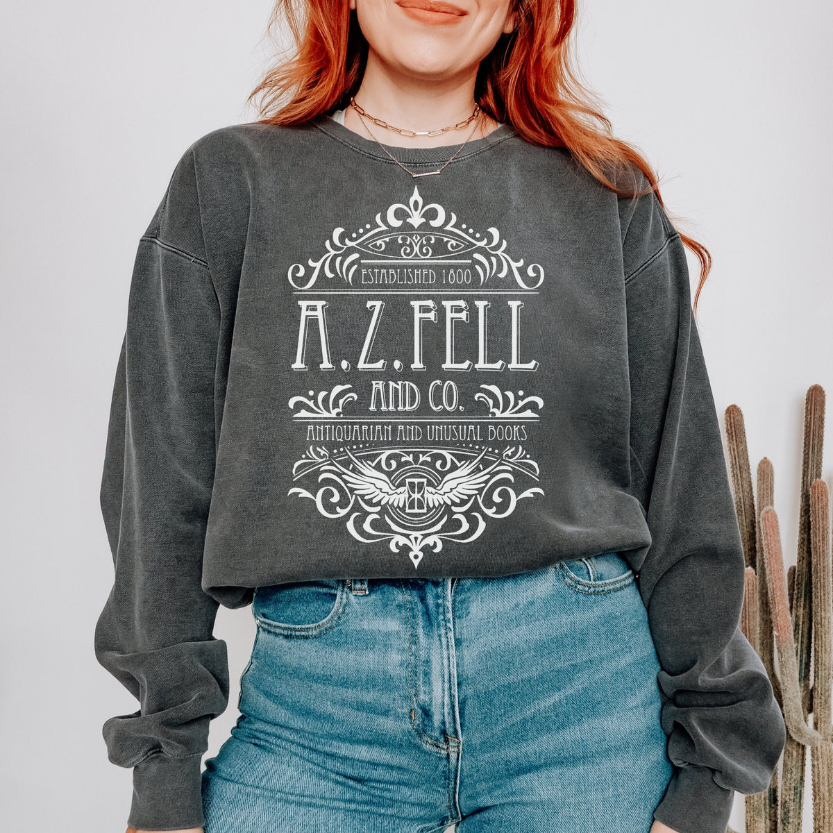 Good Omens A.Z. Fell and Co Antiquarian and Unusual graphic sweatshirt featuring Aziraphale & Crowley Comfort Colors Crewneck