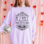 Good Omens A.Z. Fell and Co Antiquarian and Unusual graphic sweatshirt featuring Aziraphale & Crowley Comfort Colors Crewneck