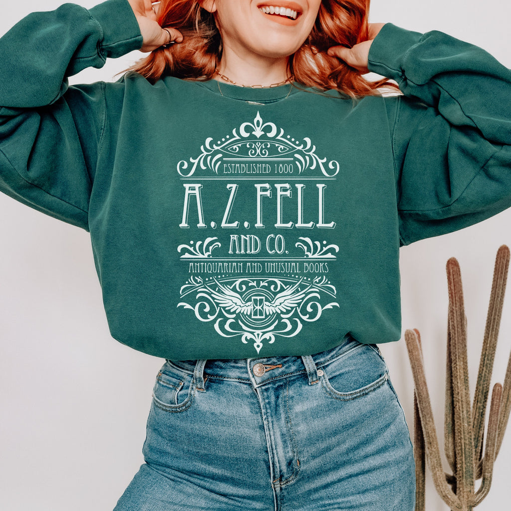 Good Omens A.Z. Fell and Co Antiquarian and Unusual graphic sweatshirt featuring Aziraphale & Crowley Comfort Colors Crewneck