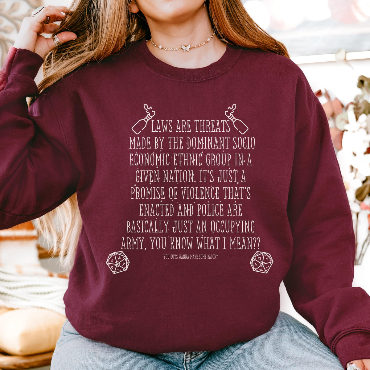 Laws Are Threats graphic sweatshirt featuring Dimension 20