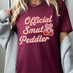 Official Smut Peddler graphic shirt featuring Spicy Bookish Tee & Romance Reader