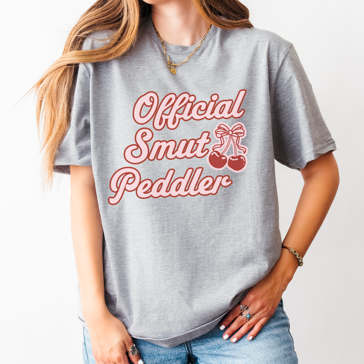Official Smut Peddler graphic shirt featuring Spicy Bookish Tee & Romance Reader