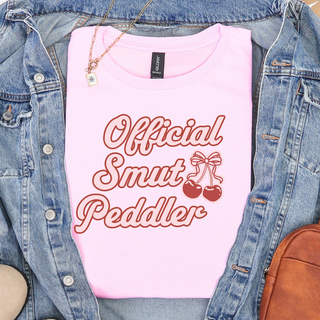 Official Smut Peddler graphic shirt featuring Spicy Bookish Tee & Romance Reader