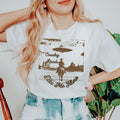 Country Roads Take Me Home graphic shirt featuring Cowboy UFO Western Graphic Tee in White