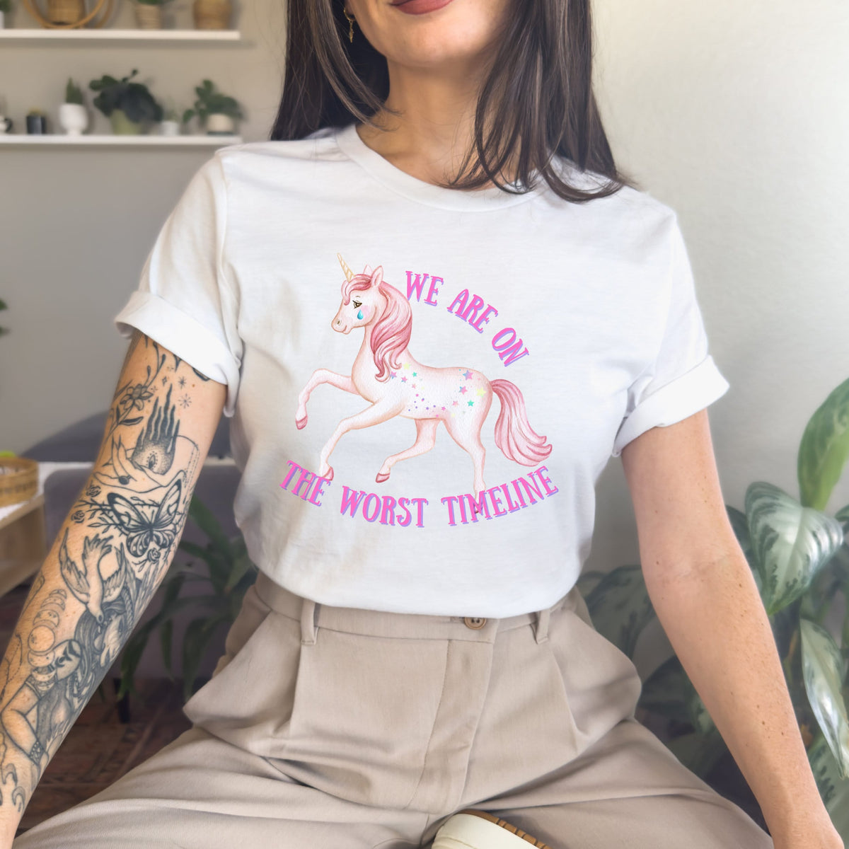 We Are on the Worst Timeline graphic shirt featuring Sad Unicorn Funny Graphic Tee