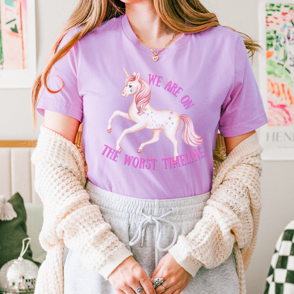We Are on the Worst Timeline graphic shirt featuring Sad Unicorn Funny Graphic Tee