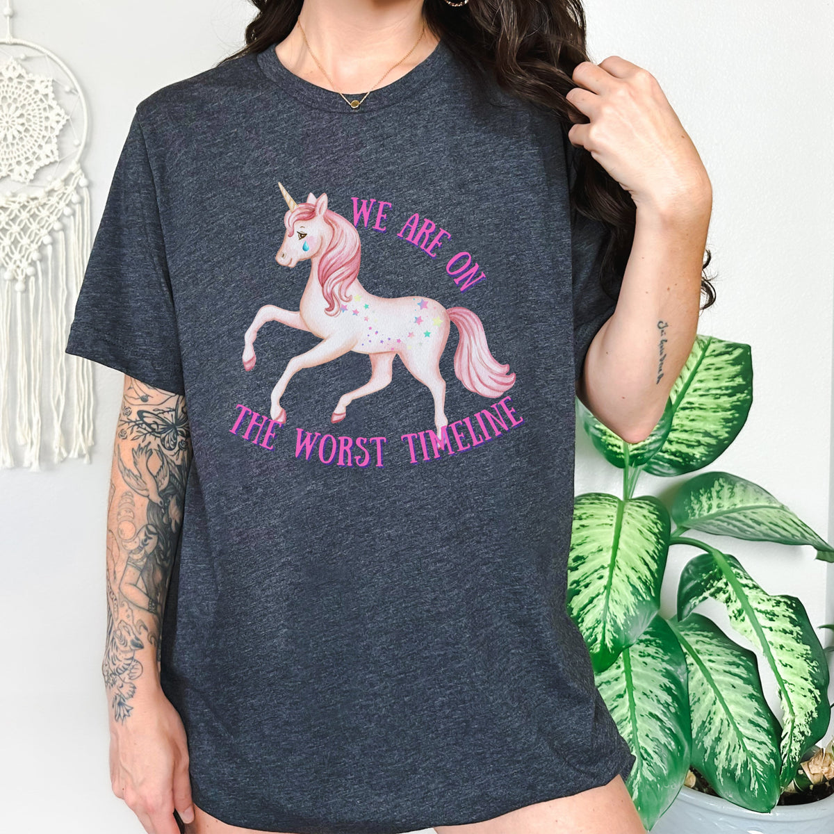 We Are on the Worst Timeline graphic shirt featuring Sad Unicorn Funny Graphic Tee