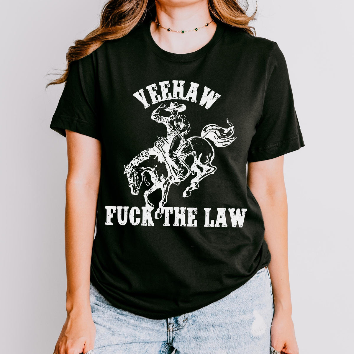 Yeehaw Fuck the Law graphic shirt featuring Outlaw Cowboy Western Graphic Tee
