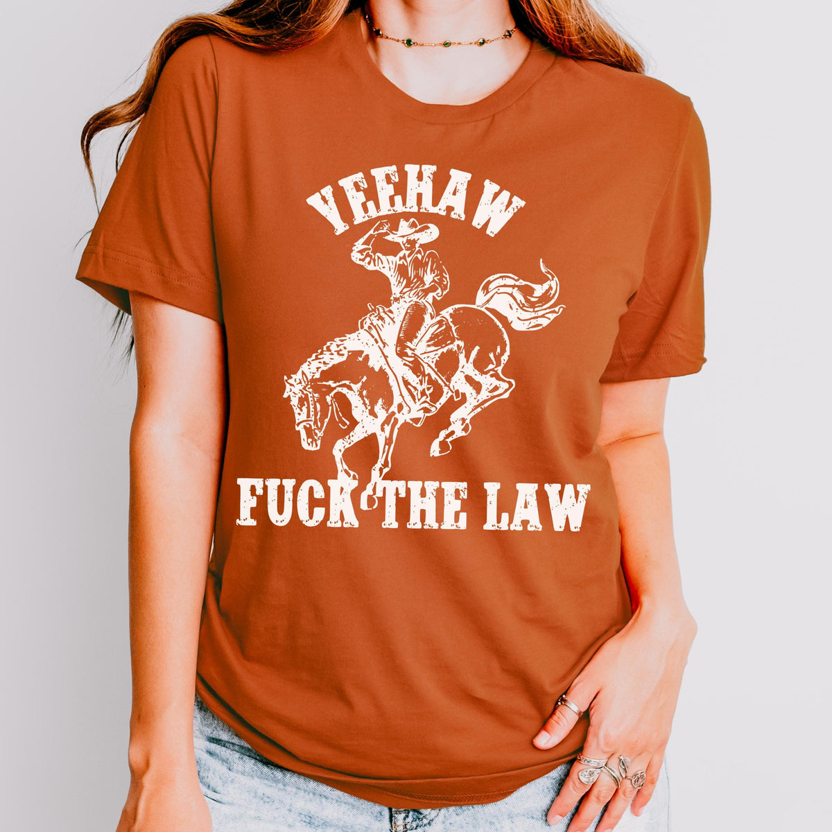 Yeehaw Fuck the Law graphic shirt featuring Outlaw Cowboy Western Graphic Tee