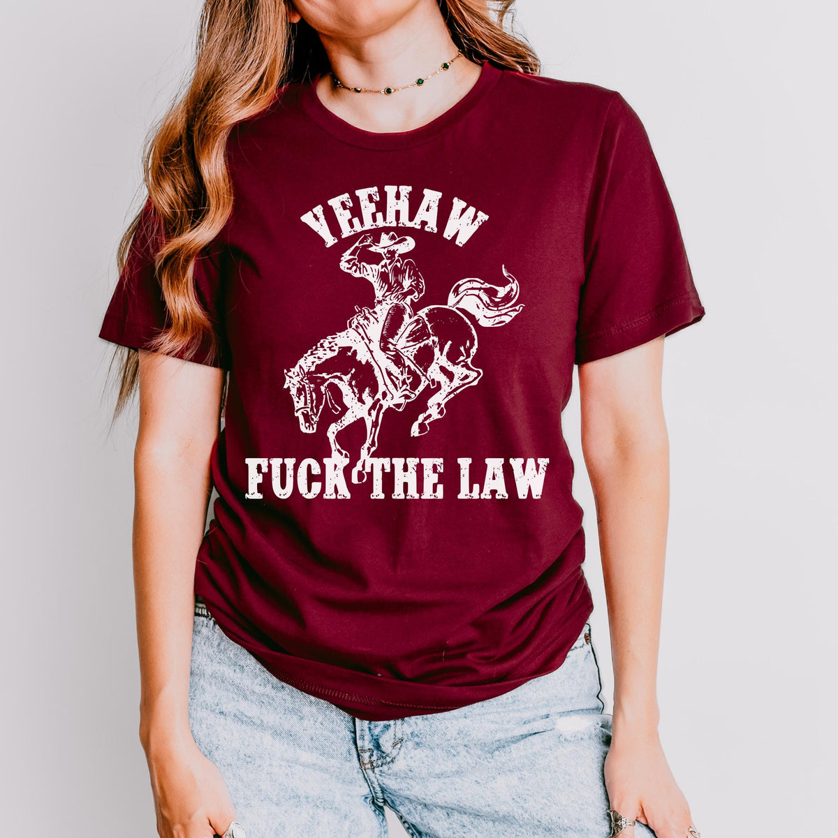 Yeehaw Fuck the Law graphic shirt featuring Outlaw Cowboy Western Graphic Tee