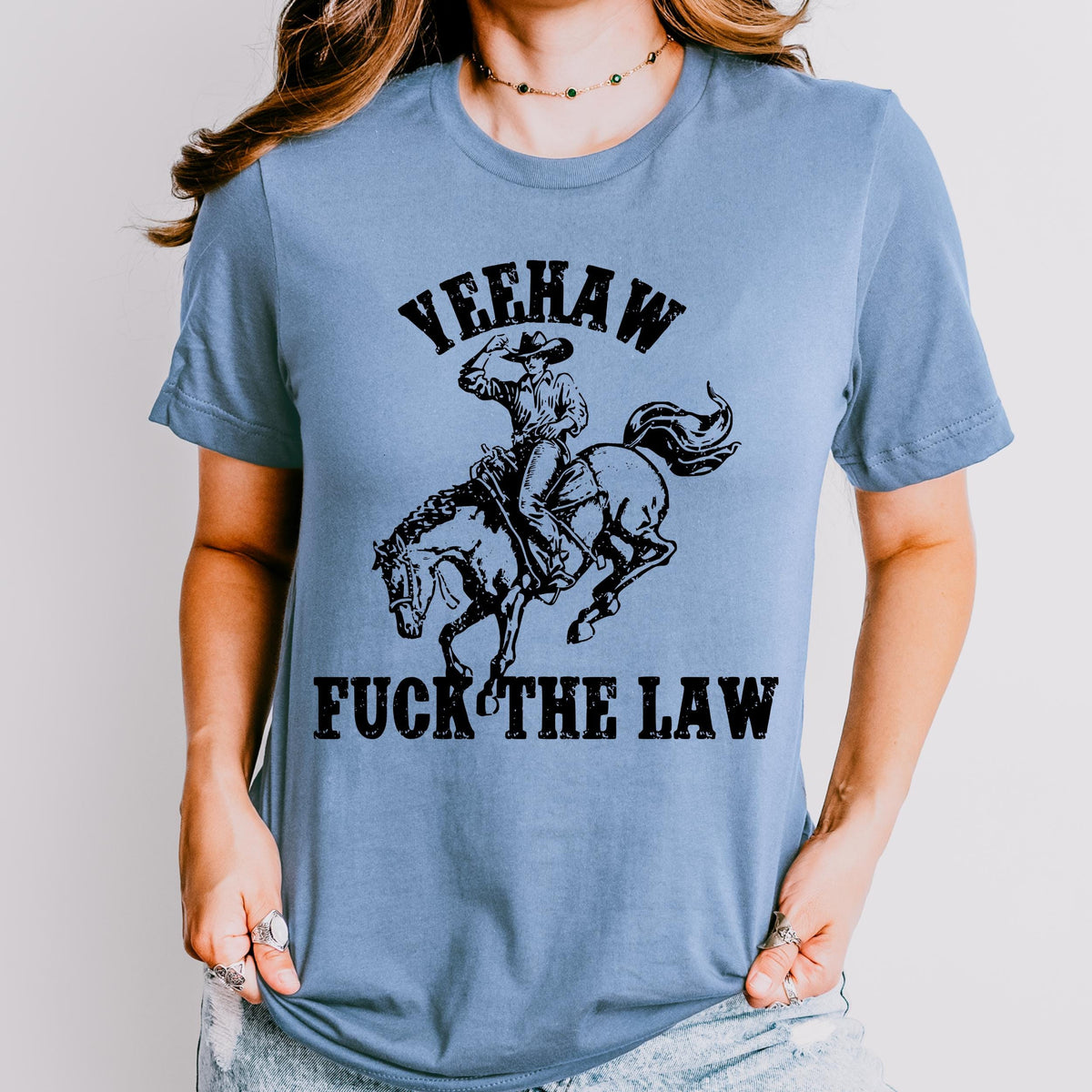 Yeehaw Fuck the Law graphic shirt featuring Outlaw Cowboy Western Graphic Tee