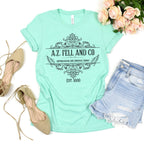 A.Z. Fell and Co graphic shirt featuring Good Omens Aziraphale Bookshop Graphic Tee