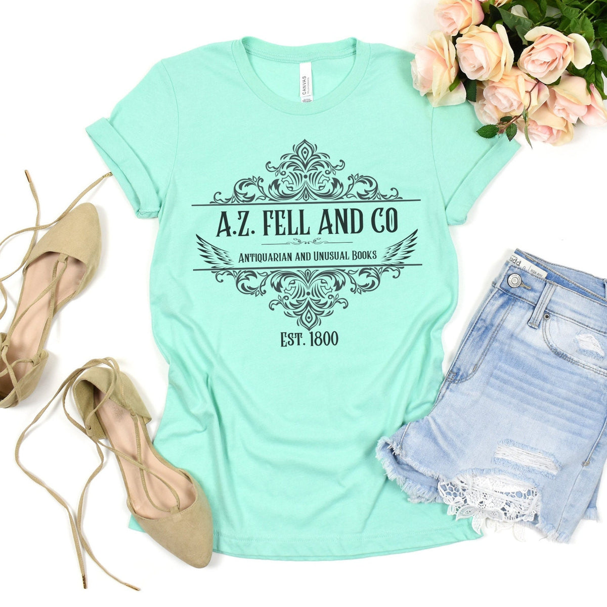 A.Z. Fell and Co graphic shirt featuring Good Omens Aziraphale Bookshop Graphic Tee