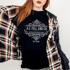 A.Z. Fell and Co graphic shirt featuring Good Omens Aziraphale Bookshop Graphic Tee