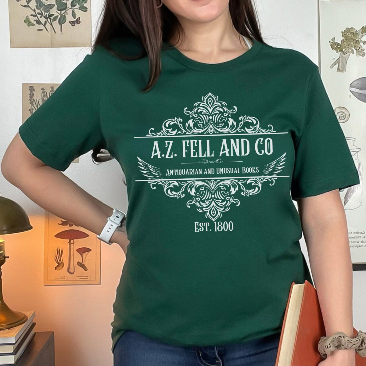 A.Z. Fell and Co graphic shirt featuring Good Omens Aziraphale Bookshop Graphic Tee