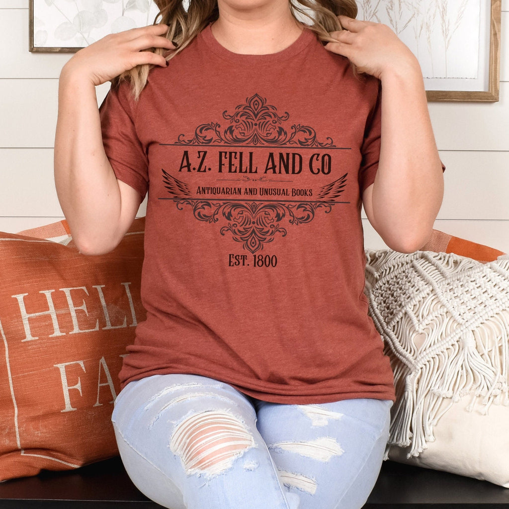 A.Z. Fell and Co graphic shirt featuring Good Omens Aziraphale Bookshop Graphic Tee
