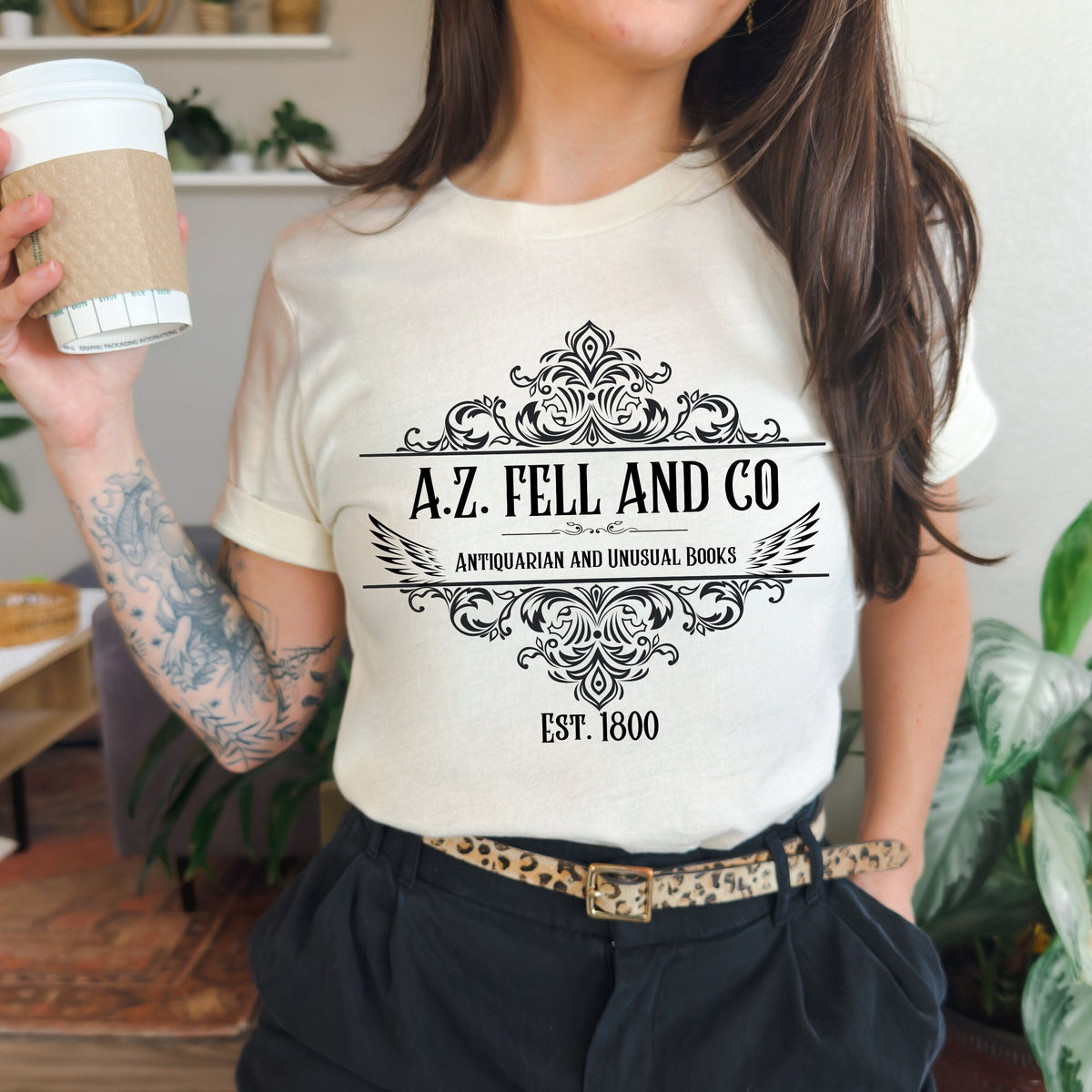 A.Z. Fell and Co graphic shirt featuring Good Omens Aziraphale Bookshop Graphic Tee in Army