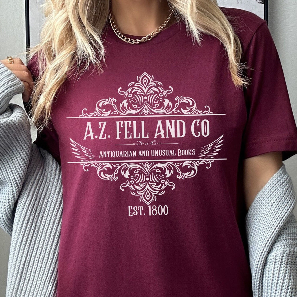 A.Z. Fell and Co graphic shirt featuring Good Omens Aziraphale Bookshop Graphic Tee