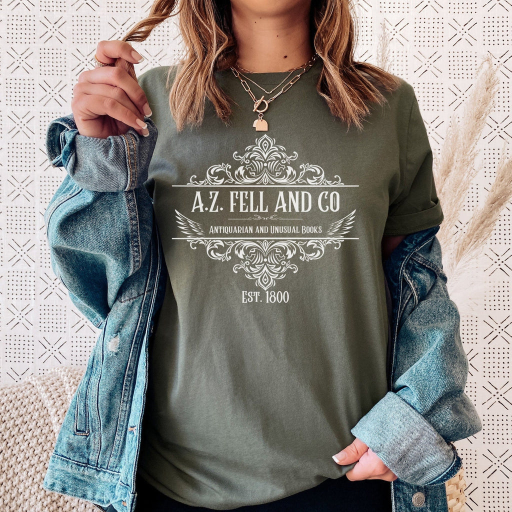 A.Z. Fell and Co graphic shirt featuring Good Omens Aziraphale Bookshop Graphic Tee