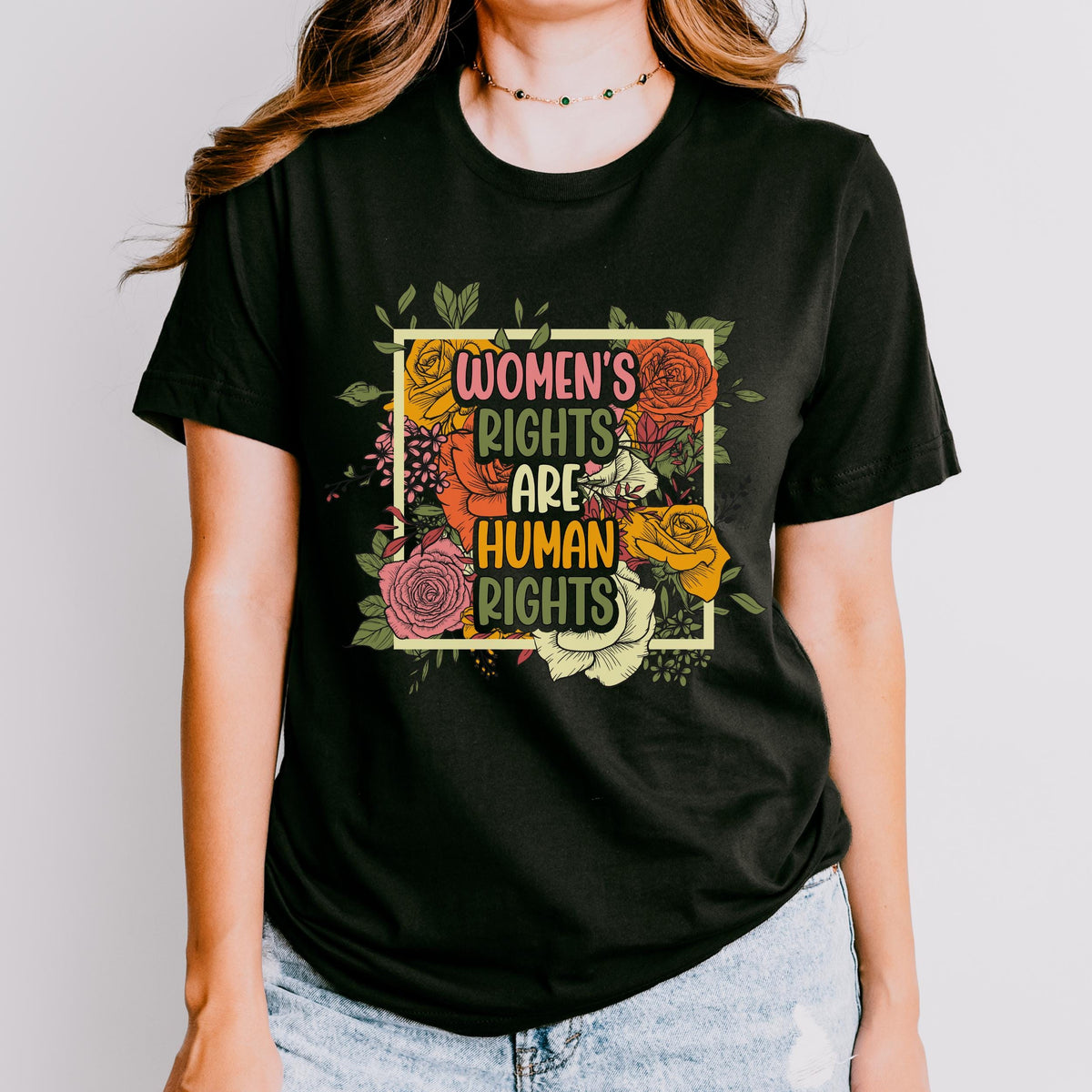 Women’s Rights Are Human Rights graphic shirt featuring Retro Floral Feminist Tee