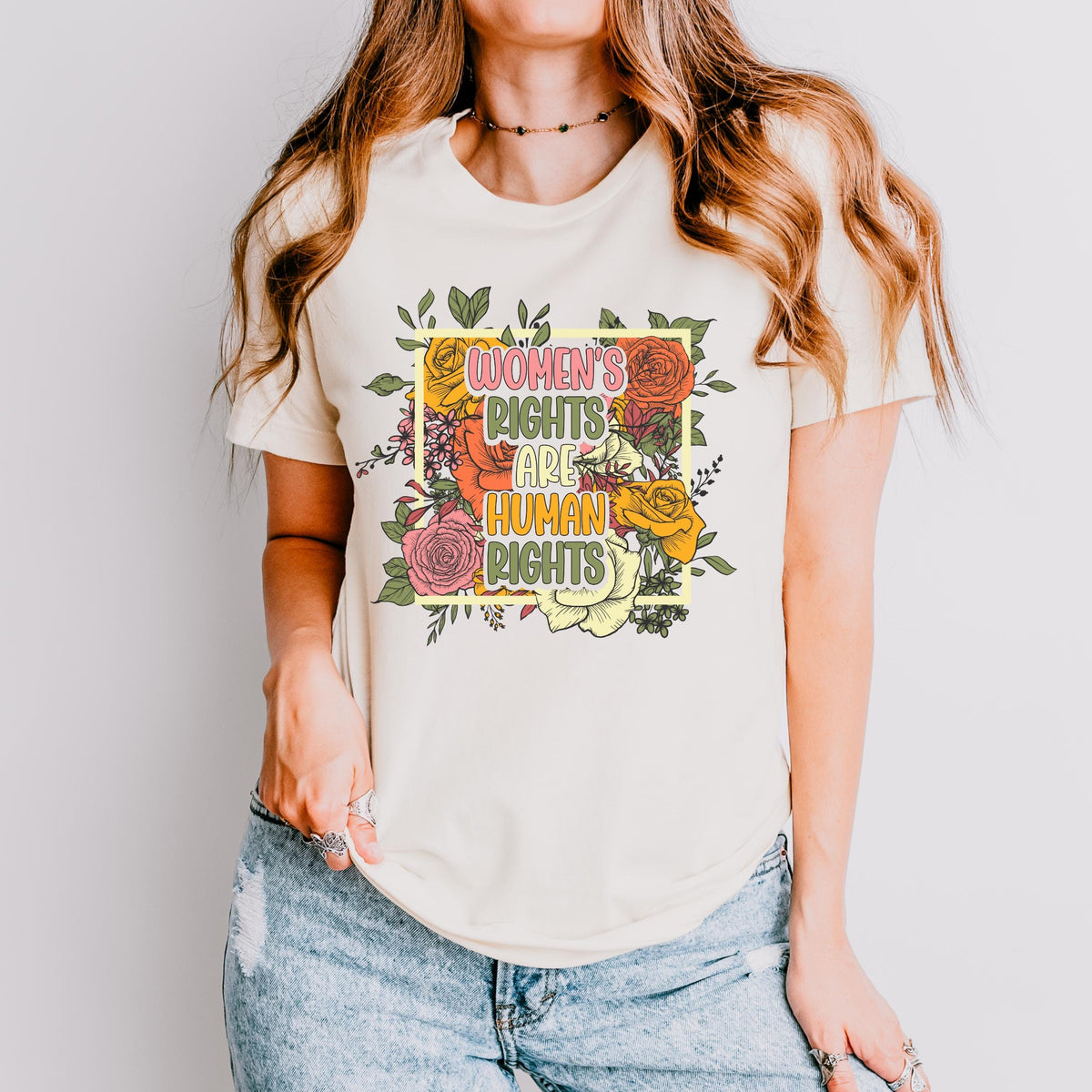 Women’s Rights Are Human Rights graphic shirt featuring Retro Floral Feminist Tee