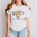 Don’t Tread on Me graphic shirt featuring Feminist Snake Uterus Graphic Tee in Sport Grey