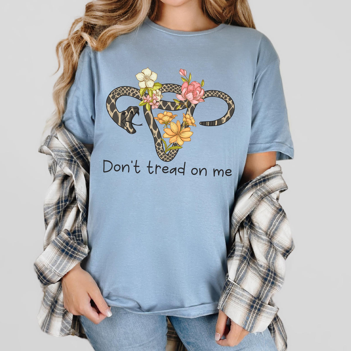 Don’t Tread on Me graphic shirt featuring Feminist Snake Uterus Graphic Tee