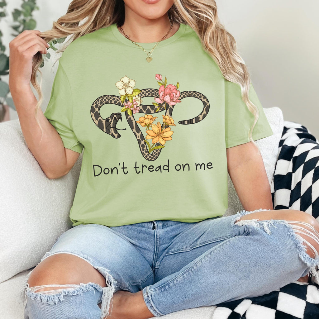 Don’t Tread on Me graphic shirt featuring Feminist Snake Uterus Graphic Tee