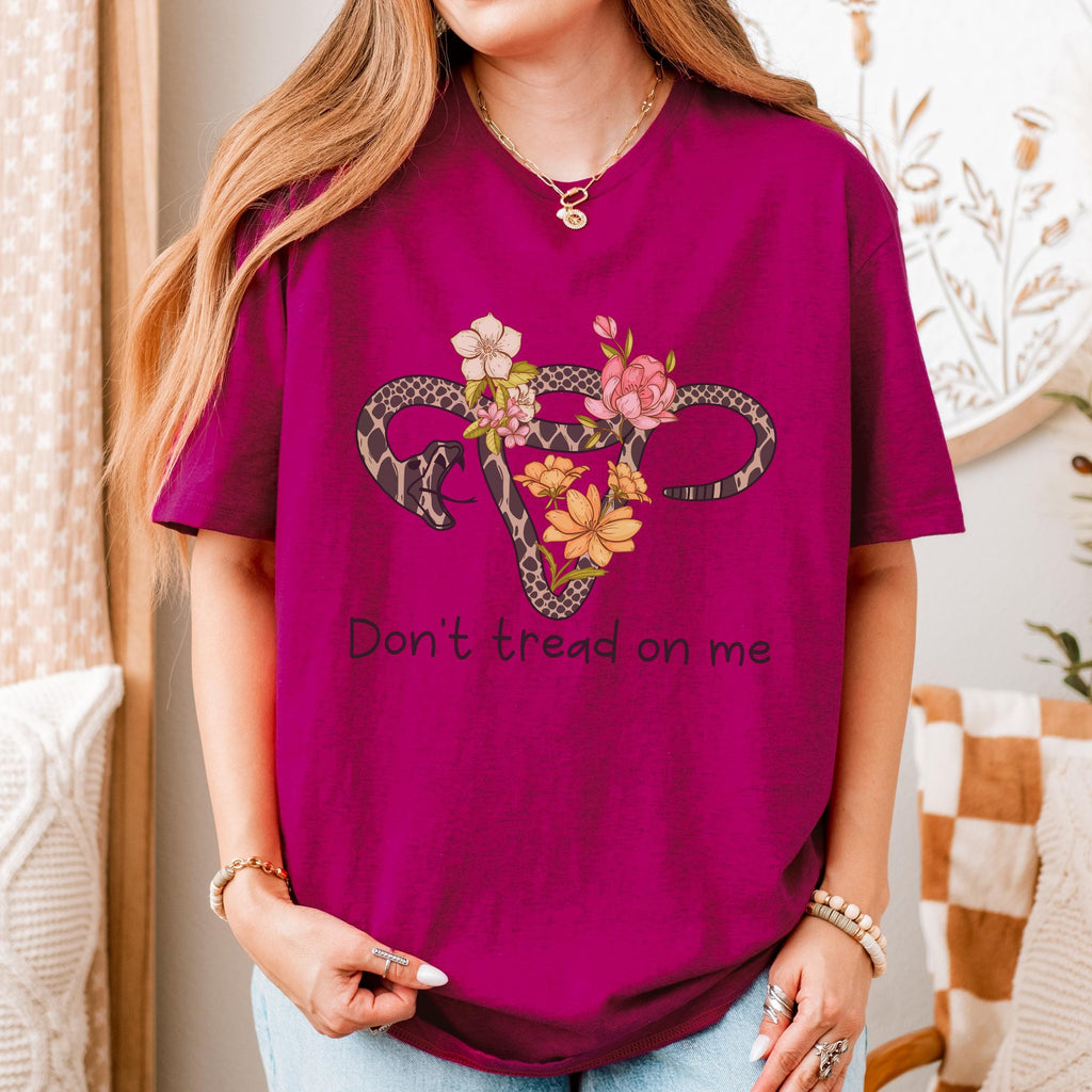 Don’t Tread on Me graphic shirt featuring Feminist Snake Uterus Graphic Tee