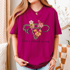 Don’t Tread on Me graphic shirt featuring Feminist Snake Uterus Graphic Tee