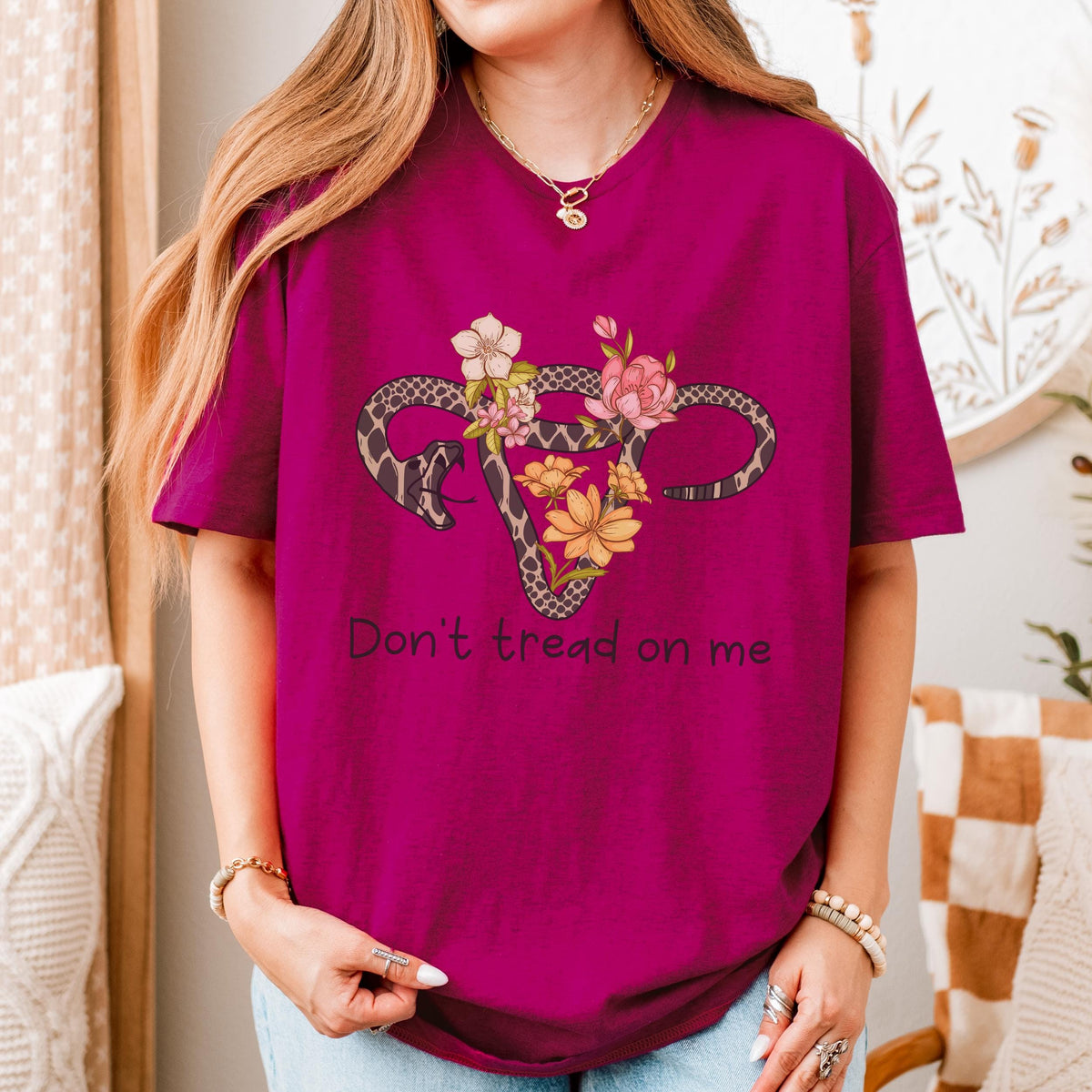 Don’t Tread on Me graphic shirt featuring Feminist Snake Uterus Graphic Tee