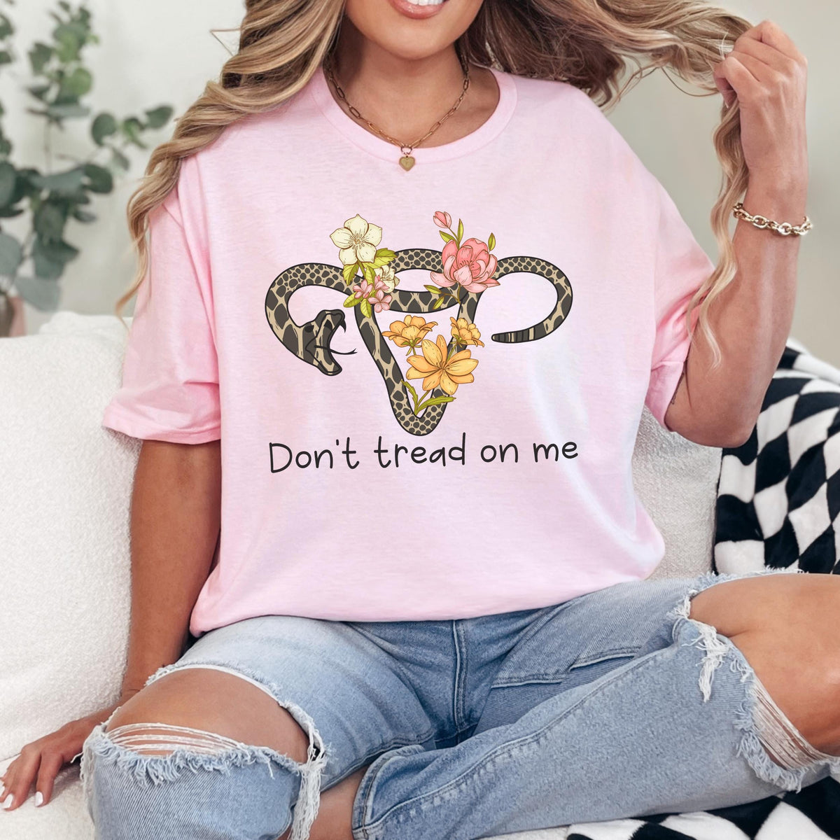 Don’t Tread on Me graphic shirt featuring Feminist Snake Uterus Graphic Tee